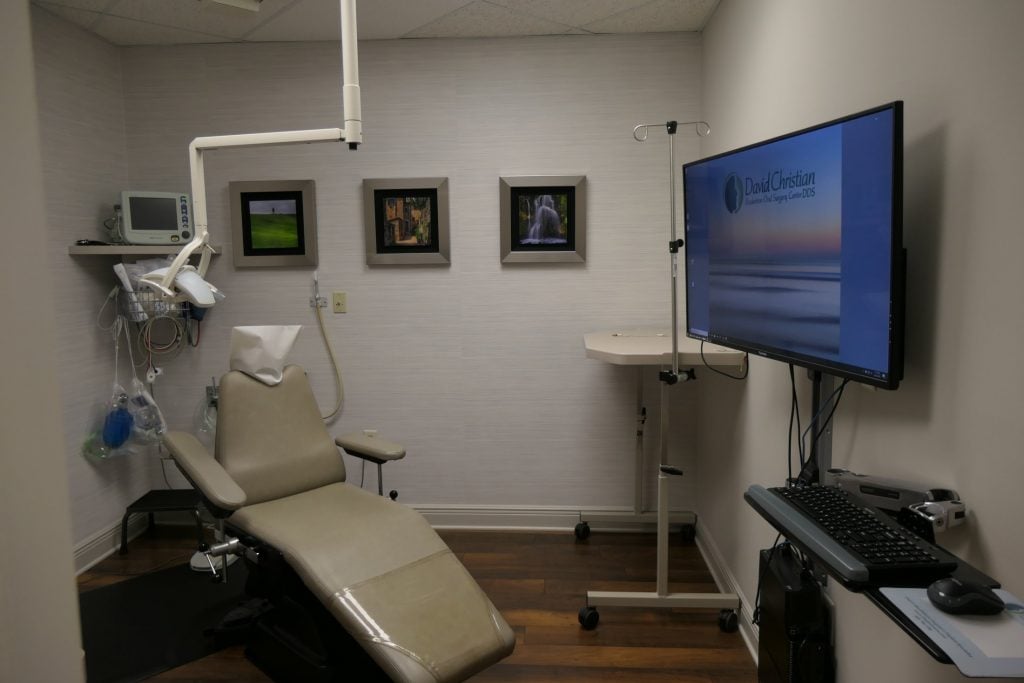 examination room with dental chair and monitor