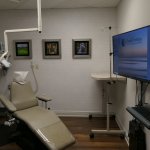 examination room with dental chair and monitor